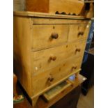 An Antique pine 4-drawer dressing chest.