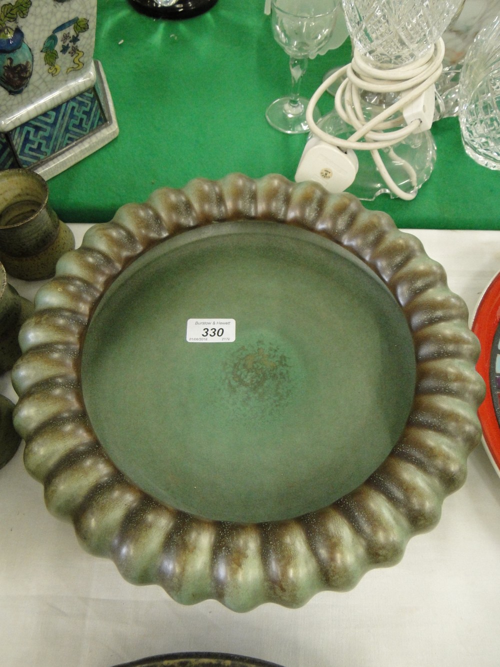 A large green glazed bowl by Michael Andersen & Sons,