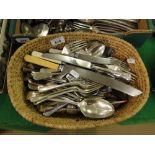 A basket of silver plated cutlery.