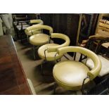 A set of 4 cream leather Corbusier style swivel chairs possibly by Cassina.