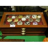 A collection of reproduction pocket watches mounted in a 3 drawer display case, (39).