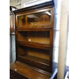 A Lebus mahogany 3-section bookcase.