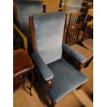 Pair of Edwardian upholstered elbow chairs and a gilt framed mirror.