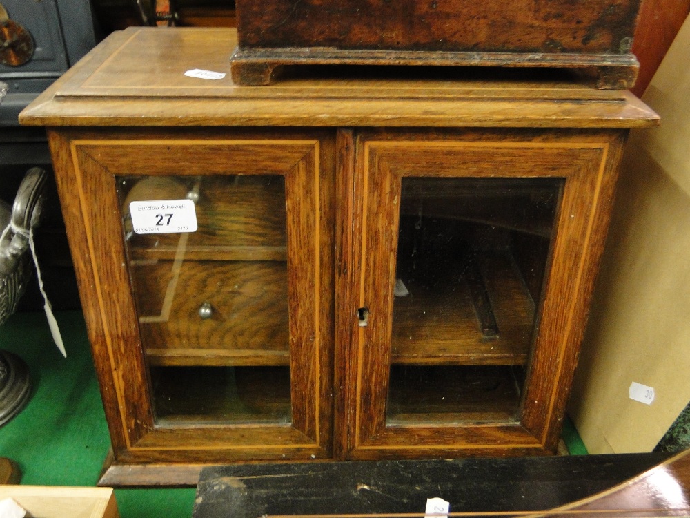 A Victorian oak smoker's cabinet with fitted drawers.