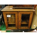 A Victorian oak smoker's cabinet with fitted drawers.