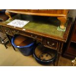 A mahogany kneehole writing desk with 3-drawers and square tapered legs.