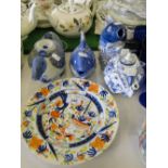 A 19th century plate, and 4 Chinese design blue and white teapots.