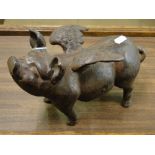 A cast-iron ornamental flying pig.