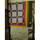 A patchwork quilt and a Kelim rug.