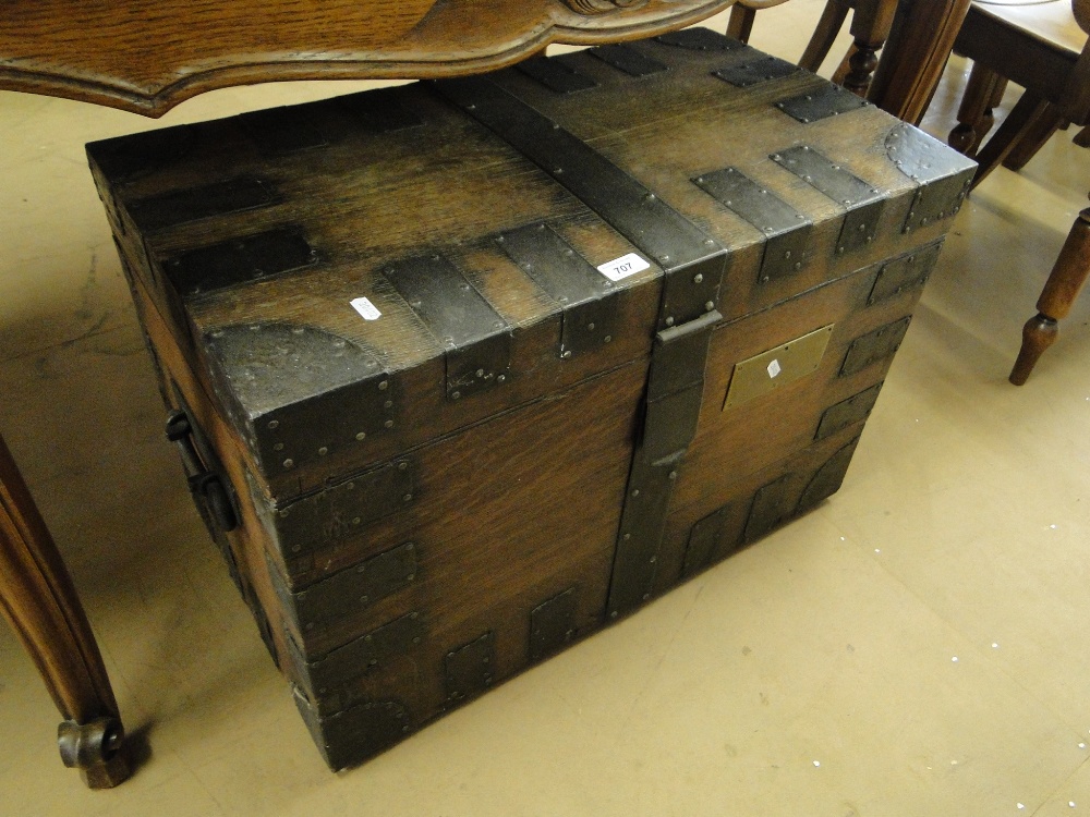 A Victorian oak and steel bound silver chest.