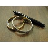 A sterling silver engraved bangle, gold plated bangle and a Swan no. 6 pen with 14ct gold nib.