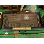 An early 20th century German harp zither, original wooden case.