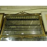 A modern gilt framed wall mirror.