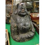 A large Chinese carved and painted terrocotta seated Buddha, height 15".