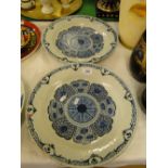 Pair of 18/19th century continental tin glazed pottery plates, with blue painted geometric designs,
