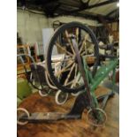 A Vintage painted spinning wheel and a Vintage painted scooter.