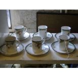 A set of 6 Royal Doulton "Awakening" coffee can and saucers.