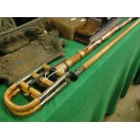 A bamboo and cane shooting stick and a horn handled walking stick,