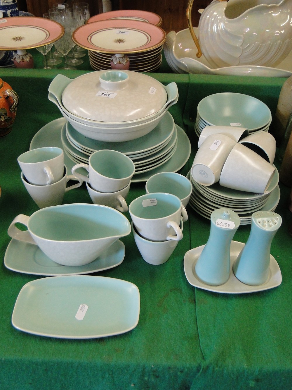 A Poole 2-tone part dinner service including tureens and meat plate.