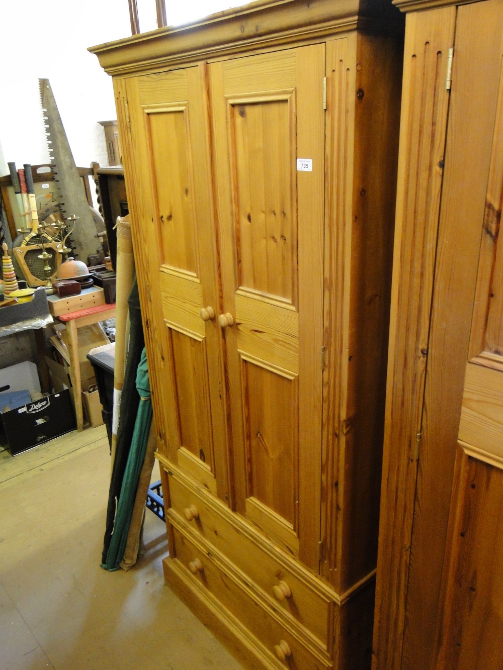 A modern panelled pine 2-door wardrobe with 2 drawers to the base.