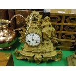 An ornate 19th century gilt metal mantel clock surmounted by a harvest girl figure.