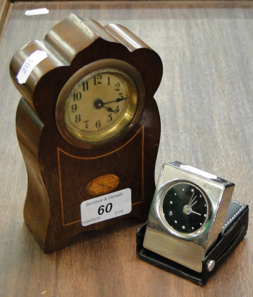 An Art Nouveau mahogany cased mantel clock and a small modern travelling clock, (2).