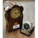 An Art Nouveau mahogany cased mantel clock and a small modern travelling clock, (2).