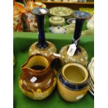 Pair of Royal Doulton long neck vases, a Doulton Harvest jug and tobacco jar.
