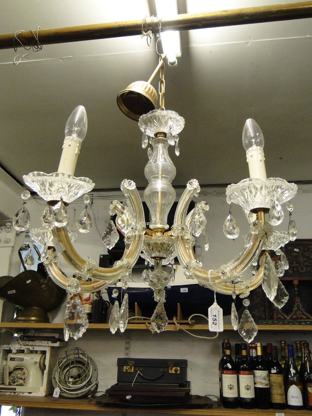A 5 branch glass chandelier with cut-glass drops.