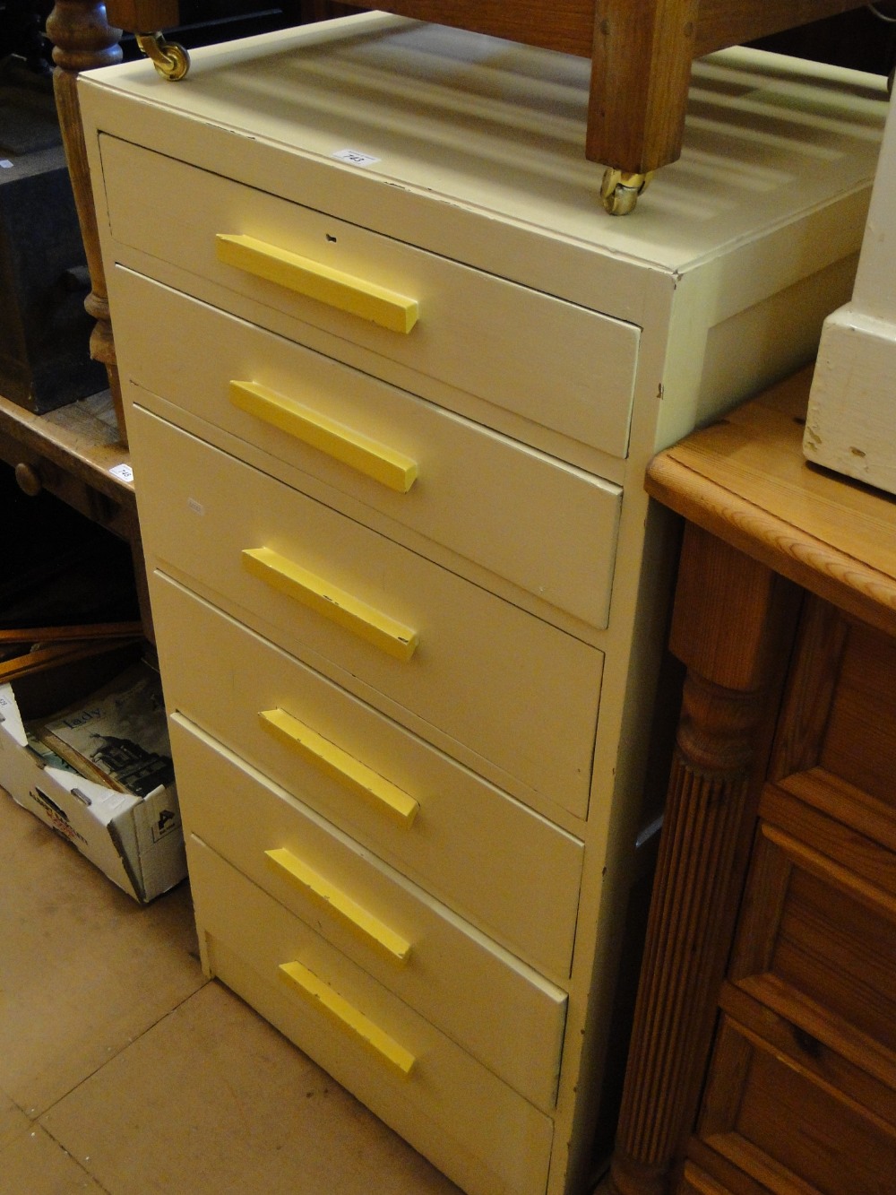 A painted 6-drawer narrow chest.