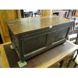 An Antique panelled oak coffer with fitted galvanised boxes.