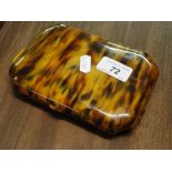An Art Deco simulated tortoiseshell travelling toilet case with fitted inner compartments and