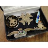 A silver fob "The Queens RWS," silver sweetheart brooch, silver and tortoiseshell pique brooch, etc.