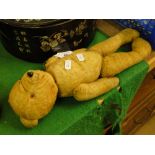 An Antique straw filled teddybear, height 14".