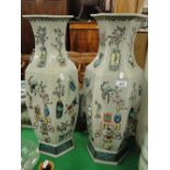 Pair of tall Chinese design panelled vases with applied decoration.