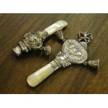 2 silver and mother of pearl babys rattles.