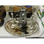 Silver plated and embossed coffee pot, pair of plated candlesticks, tray and cutlery.