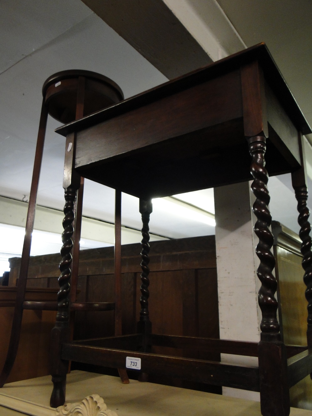 A mahogany jardiniere stand and an oak barleytwist occasional table.