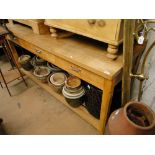 A modern beech and pine serving table, with 3 drawers, pot board under raised on square legs.