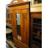 A satin walnut single mirror door wardrobe.