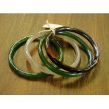 3 jade bangles and another.