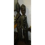 A pair of carved and painted wood ornamental soldiers, height 4'.