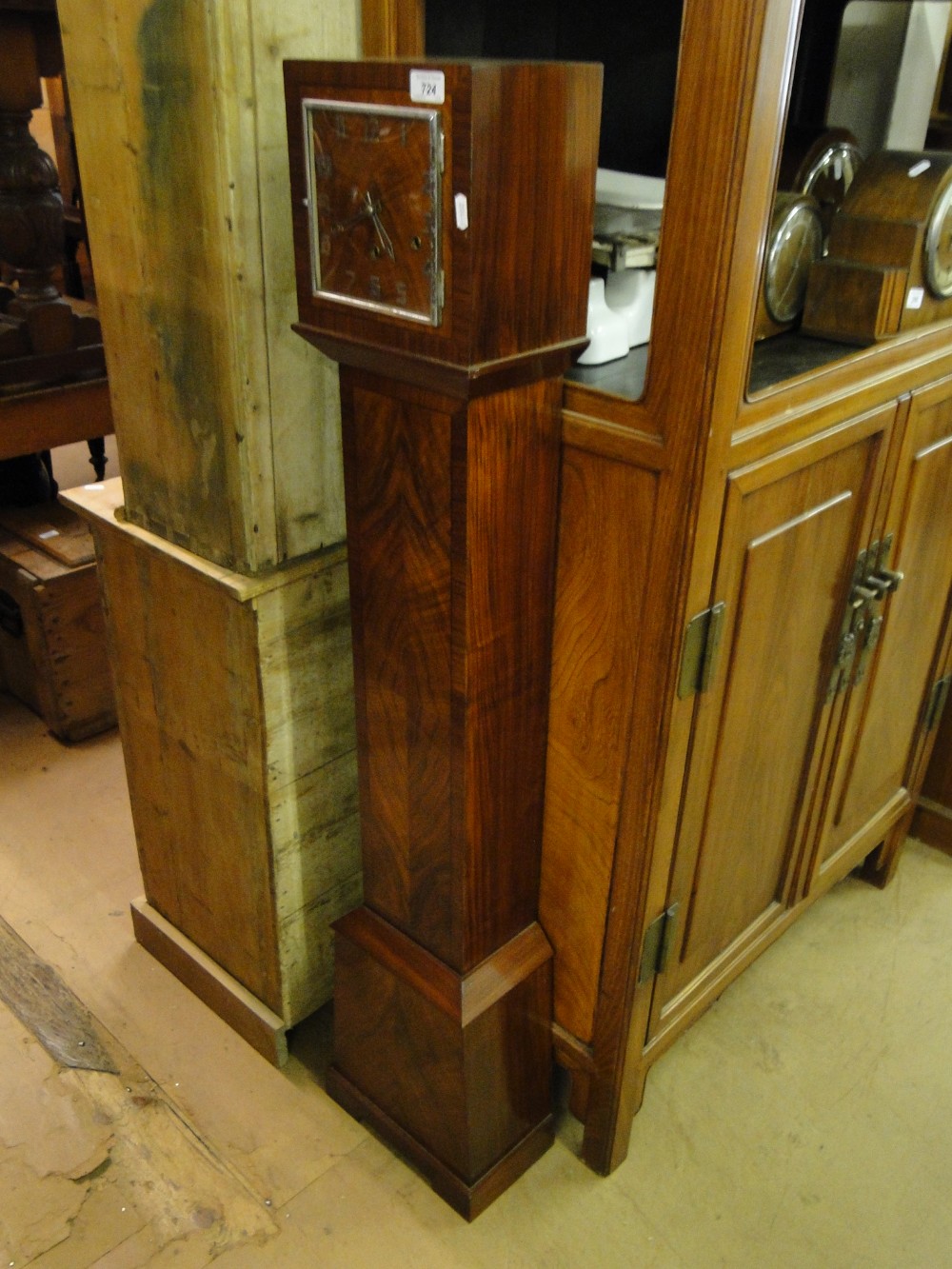 An Art Deco walnut 3-train Grandmother clock.