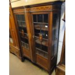 A late Victorian mahogany display cabinet, having 2 lattice glazed doors,