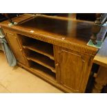 A mahogany side cabinet with open shelves and cupboards, on bracket feet.