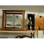 Pair of laboratory scales in glass case and a Beck student's microscope, (2).