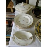 A French porcelain part dinner service, comprising oval tureen and cover,
