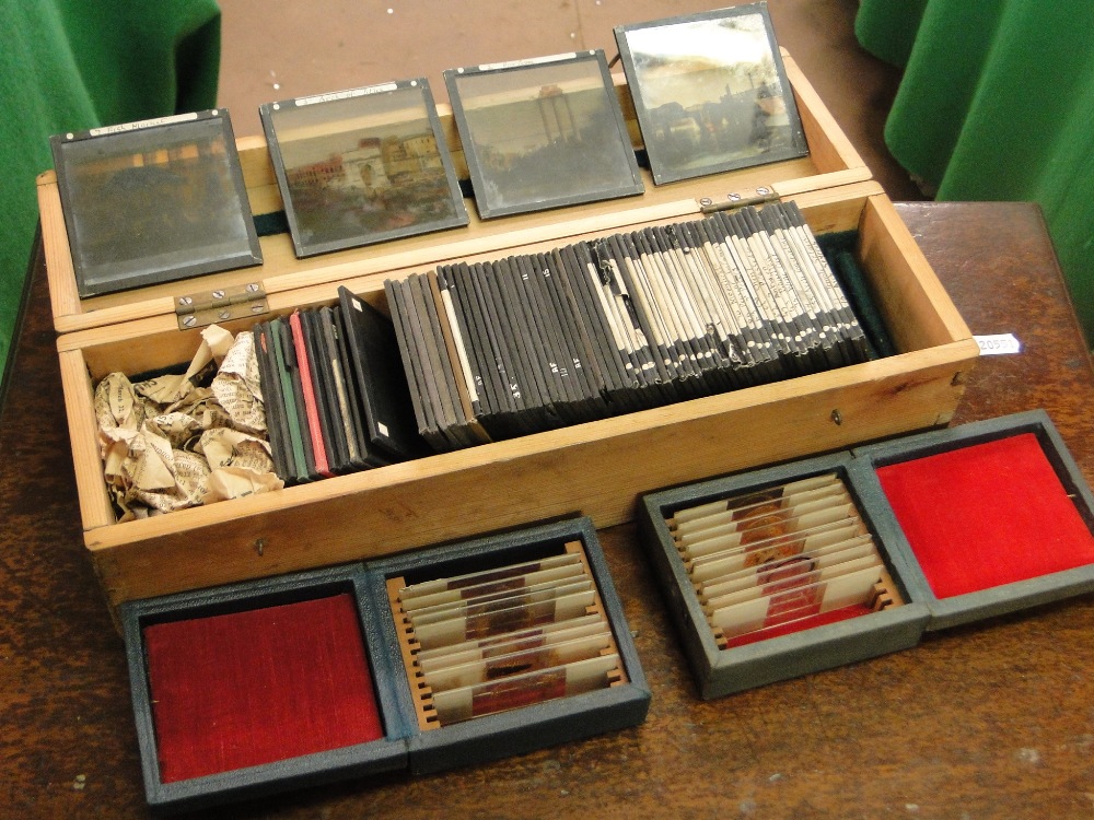 A box of antique coloured glass slides and two boxes of microscope slides