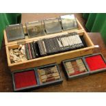A box of antique coloured glass slides and two boxes of microscope slides