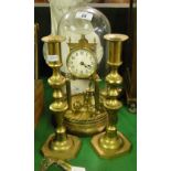 A pair of brass candlesticks and a 400-day clock